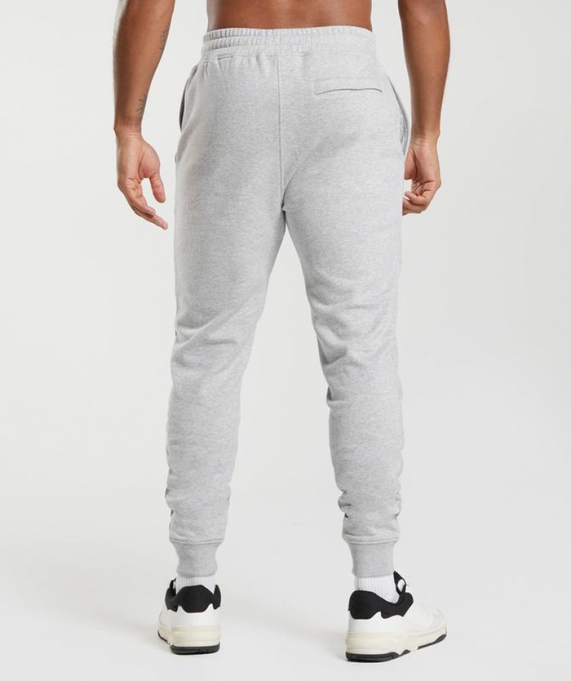 Pantalones Gymshark Crest Joggers Gris Claro | LIUYW0369